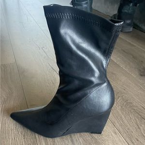 Brand New boots. Never worn. Black with really cool heel